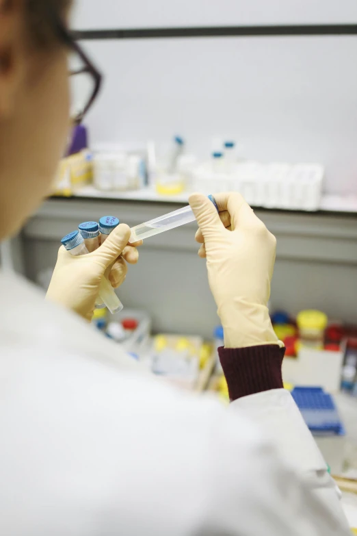 a close up of a person in a lab, a picture, holding a syringe, panel, high quality picture, thumbnail