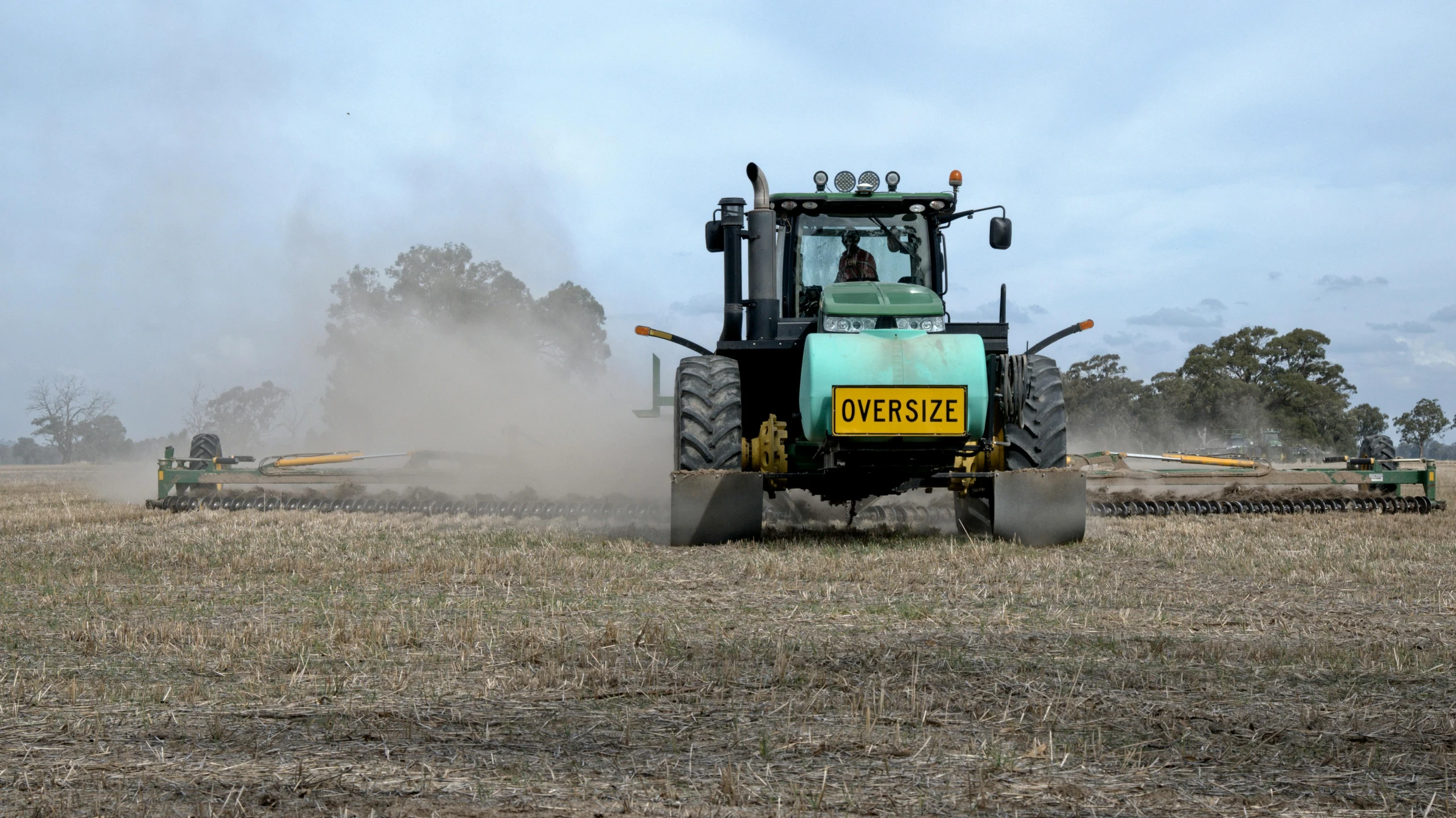 a tractor that is sitting in the dirt, by Dave Allsop, green gas spreading across land, stubble, thumbnail, profile image