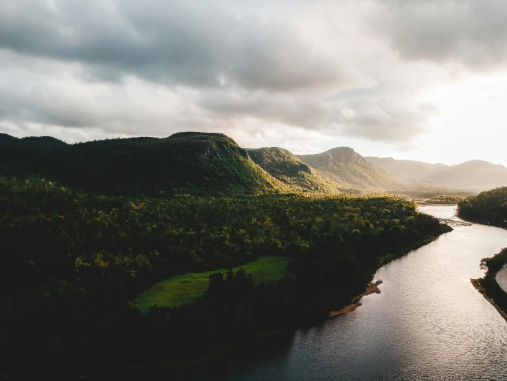 a river running through a lush green valley, pexels contest winner, australian tonalism, sun down, build in a forest near of a lake, instagram post, puerto rico