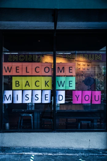 a window with a sign that says welcome back we missed you, by Kristin Nelson, merged, paul barson, customers, mixed