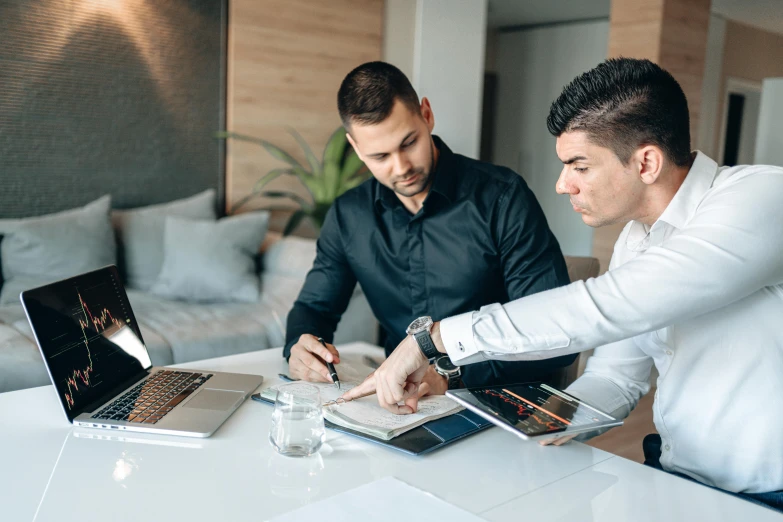 two men sitting at a table working on laptops, pexels contest winner, corporate style, lachlan bailey, planning, decorative