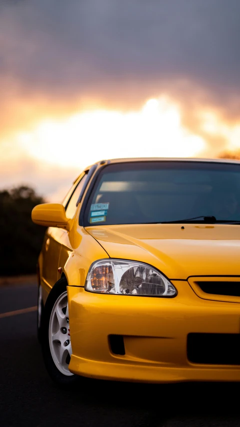a yellow car parked on the side of the road, unsplash, photorealism, honda civic, golden hour closeup photo, 15081959 21121991 01012000 4k