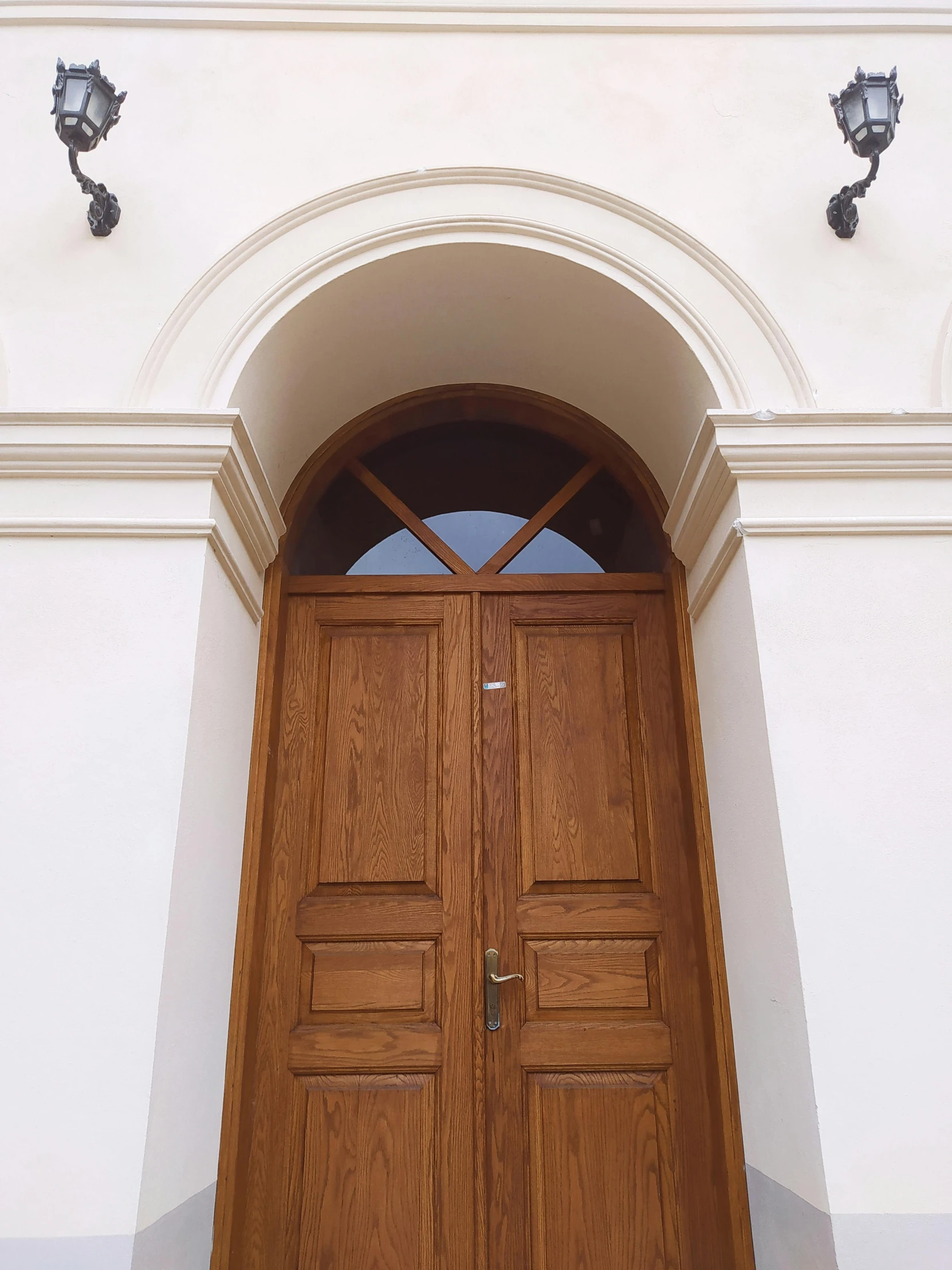 a close up of a wooden door on a building, inspired by Károly Markó the Elder, neoclassicism, high arched ceiling, window open, pristine and clean, private school