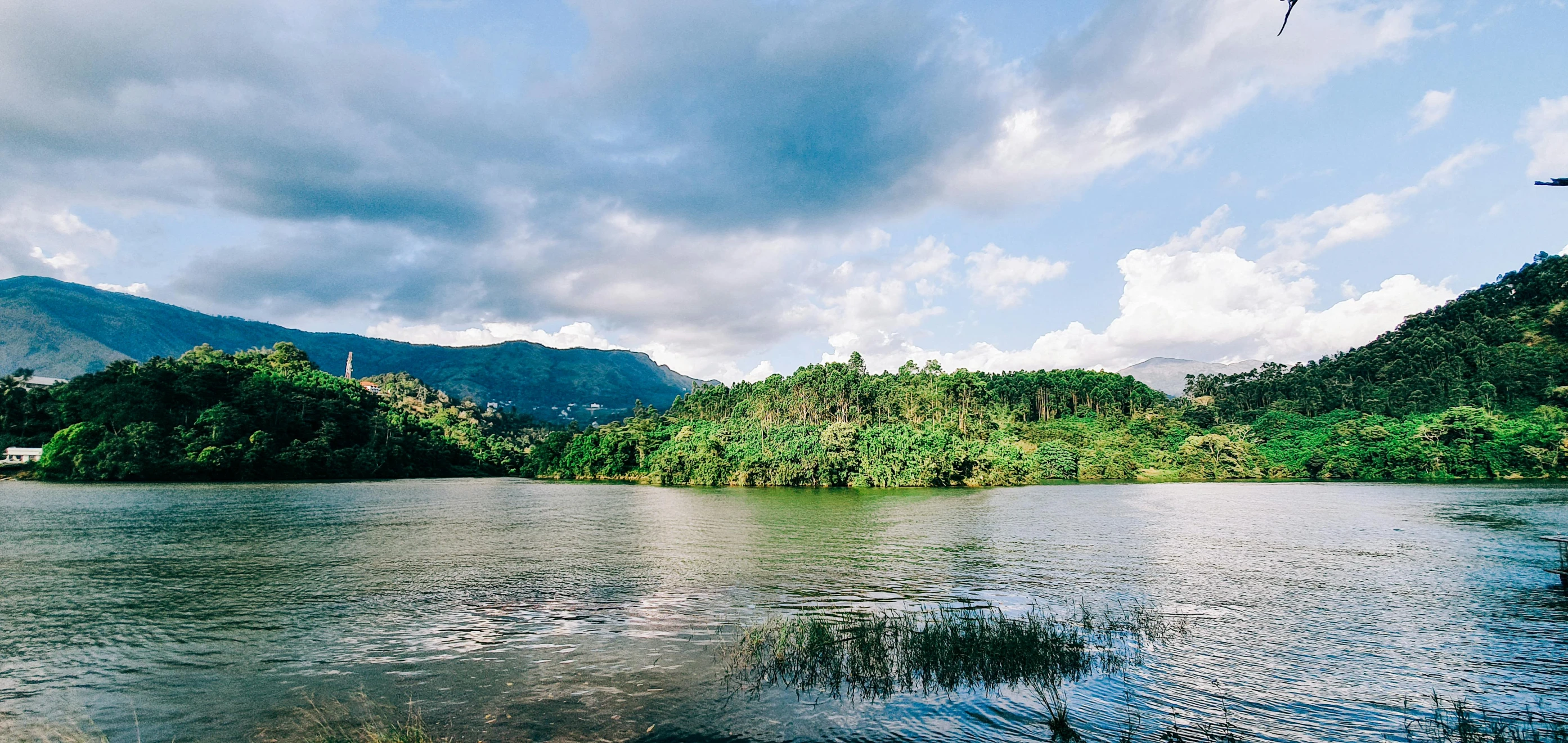 a body of water with mountains in the background, hurufiyya, sri lanka, multiple stories, lachlan bailey, sydney park