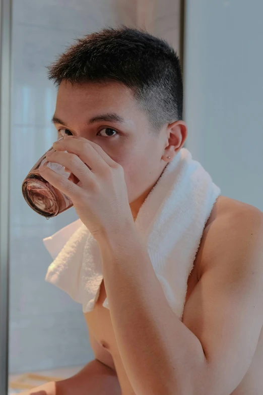 a man drinking from a cup in front of a mirror, reddit, wearing a towel, set on singaporean aesthetic, profile image, wet shiny skin