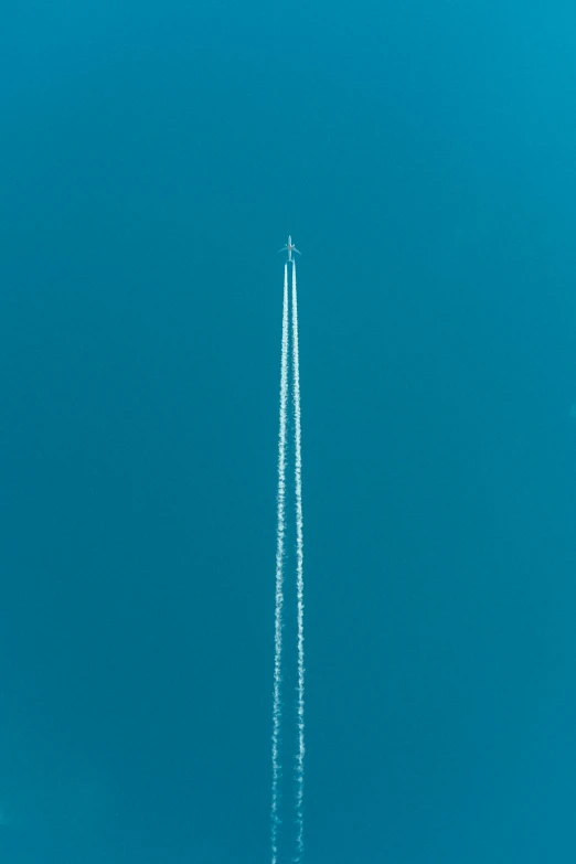 a large jetliner flying through a blue sky, by Matthias Weischer, postminimalism, top - down photograph, image, rocket launch, aerial