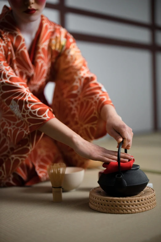 a woman in a kimono sitting on the floor, trending on unsplash, teapot : 1, square, pouring, high quality photo