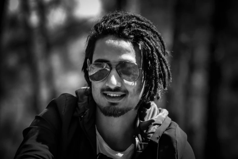 a black and white photo of a man with dreadlocks, a black and white photo, pexels contest winner, hurufiyya, with sunglass, jayison devadas, facebook profile picture, brown skin man egyptian prince