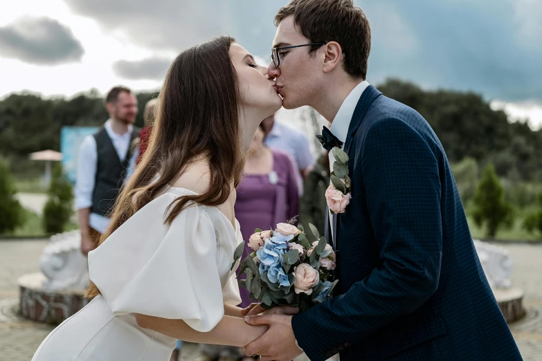 a man giving a woman a kiss on the cheek, a picture, pexels contest winner, holy ceremony, lachlan bailey, profile image, casually dressed