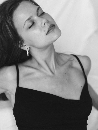 a black and white photo of a woman in a black dress, in ecstasy, wearing a cropped black tank top, neck up, suzanne engelberg
