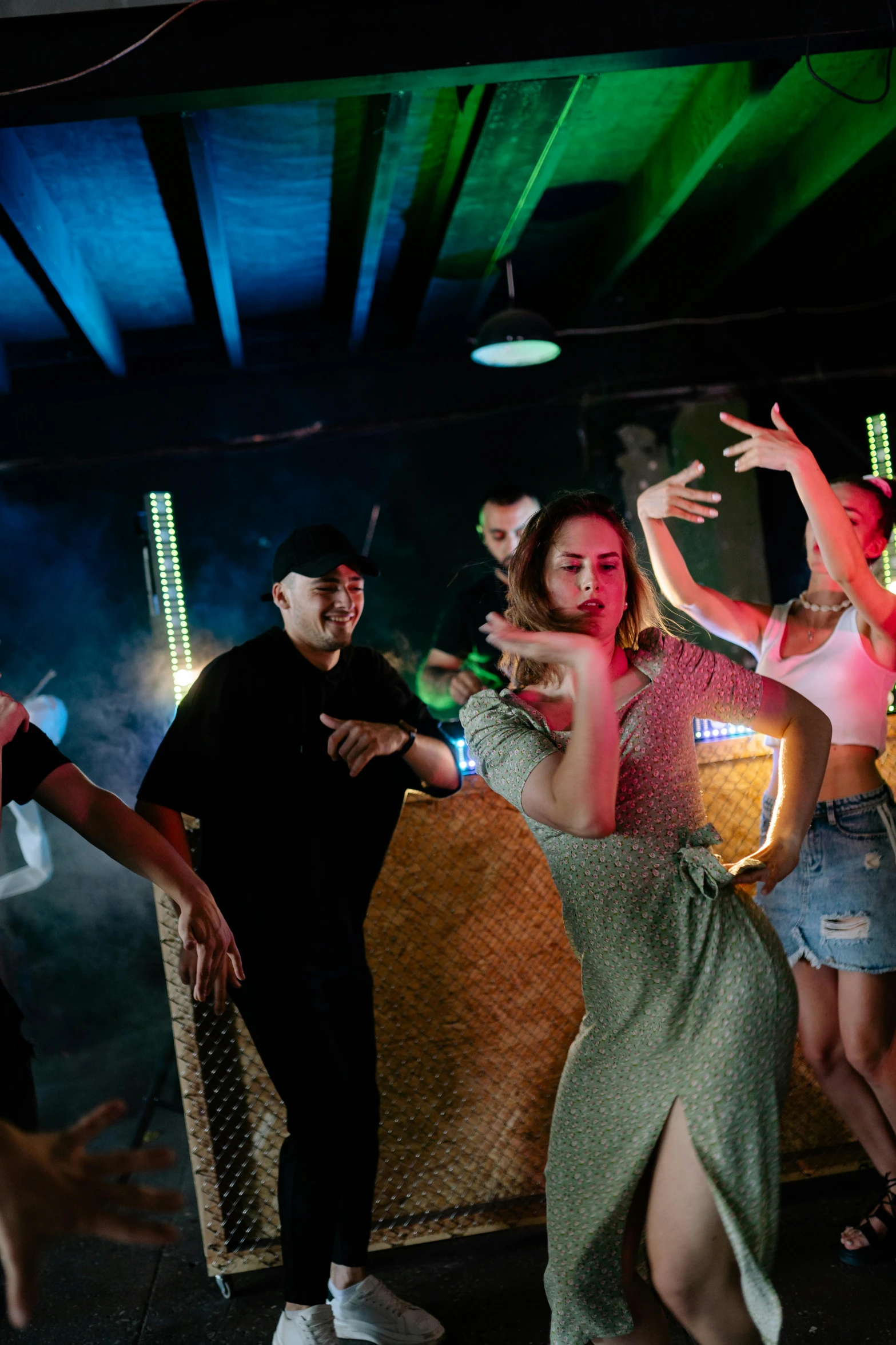 a group of people dancing at a party, manila, shot with sony alpha 1 camera, cinematic-shot, square