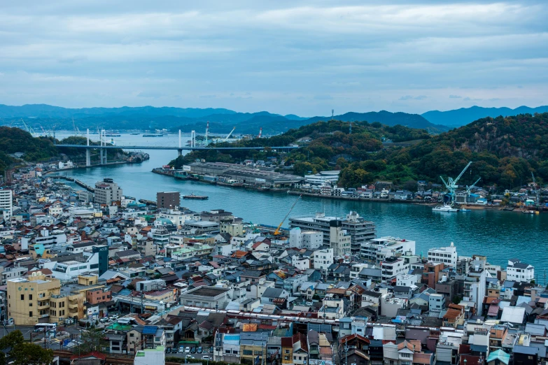 a large body of water surrounded by lots of buildings, by Yasushi Sugiyama, pexels contest winner, sōsaku hanga, japan shonan enoshima, thumbnail, slide show, high resolution photo