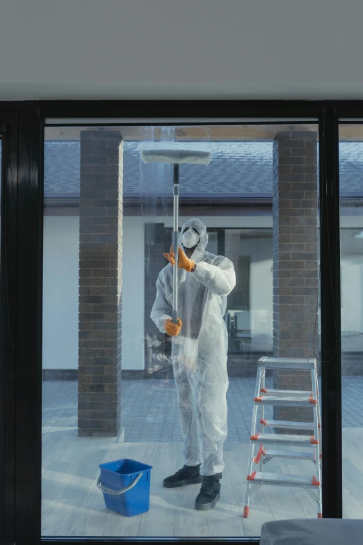 a man in a hazmat suit standing in front of a window, a hyperrealistic painting, unsplash, hyperrealism, clean architecture, repairing the other one, circular, high render