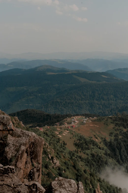 a couple of people standing on top of a mountain, les nabis, black forest, slightly pixelated, overview, low quality photo