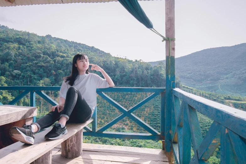 a woman sitting on top of a wooden bench, inspired by Ma Yuanyu, pexels contest winner, sumatraism, avatar image, green terrace, dang my linh, profile image