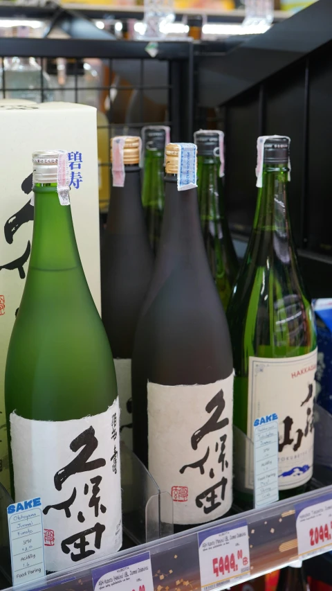 a bunch of bottles that are on a shelf, pexels, sōsaku hanga, with labels and notes, traditional, high detail photo, a high angle shot