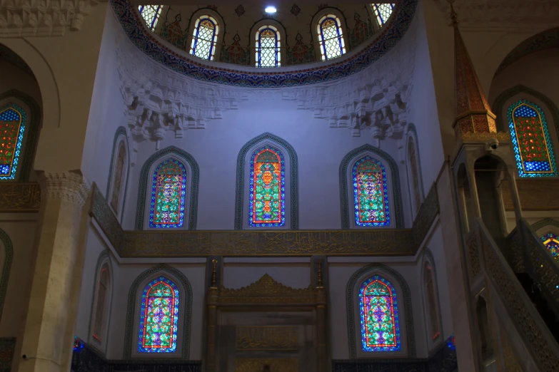 the inside of a building with stained glass windows, hurufiyya, profile image, fan favorite, mosque, vray tracing