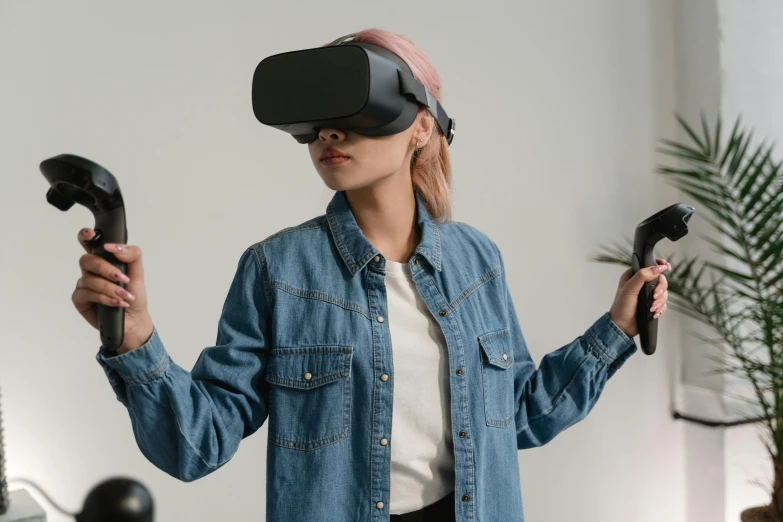 a woman in a denim shirt holding a video game controller, a hologram, trending on pexels, interactive art, 3 d goggles, wearing a dark shirt and jeans, avatar image