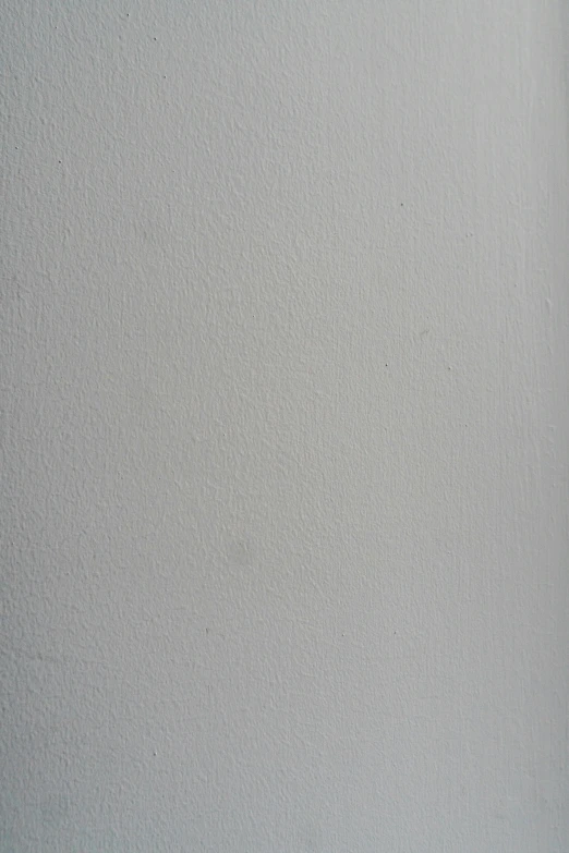 a white toilet sitting in a bathroom next to a toilet paper dispenser, a minimalist painting, inspired by Louis-Léopold Boilly, unsplash, postminimalism, 2 5 6 x 2 5 6, texture detail, 256x256, painting a canvas