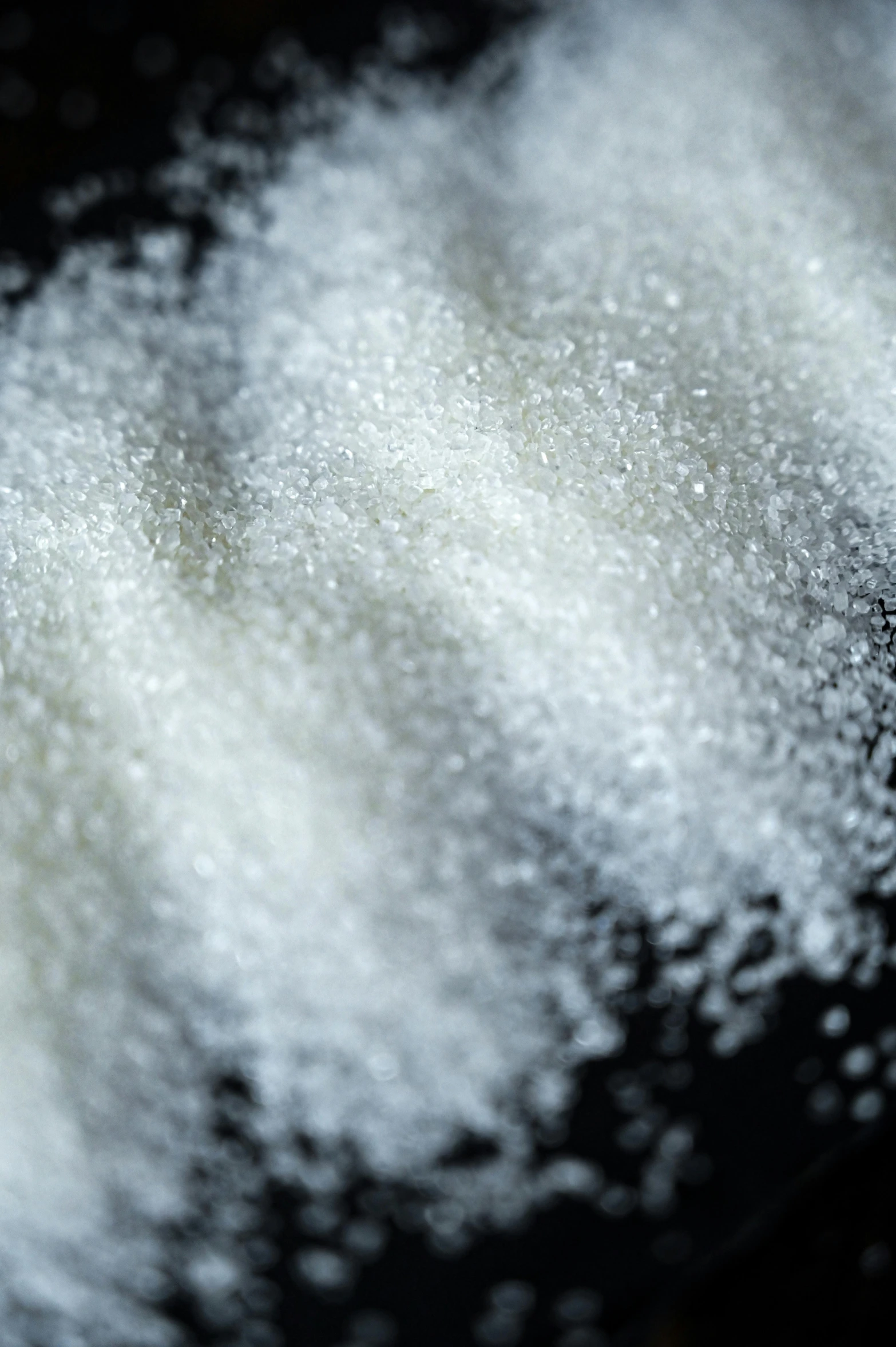 a pile of sugar sitting on top of a table, a stipple, trending on pexels, ldpe, closeup of arms, white: 0.5, atmospheric