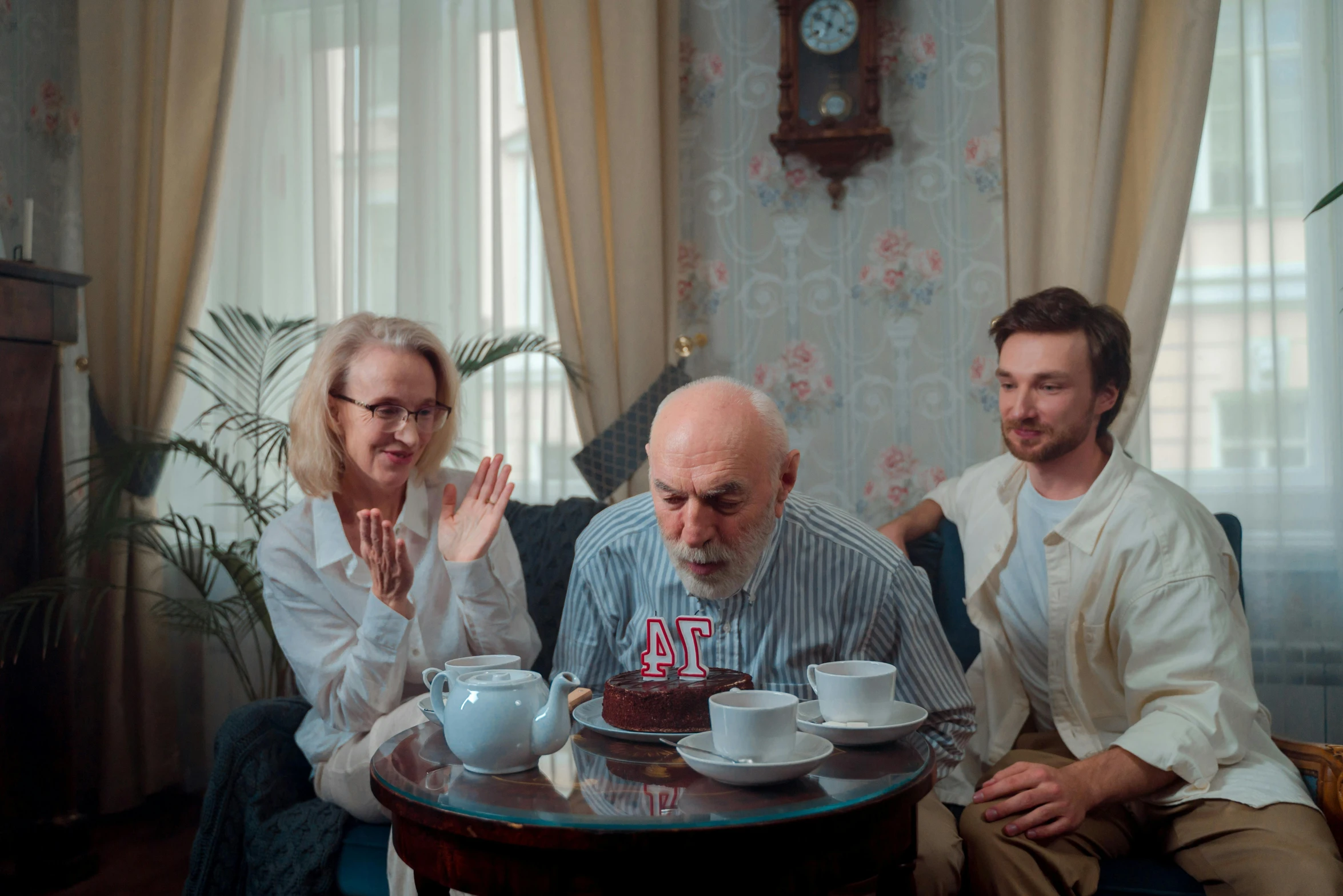 a group of people sitting around a table, by Adam Marczyński, pexels contest winner, hyperrealism, grumpy [ old ], seinfeld fancy tea party, celebrating a birthday, ( ( theatrical ) )