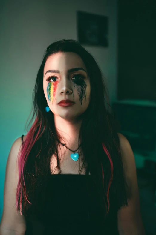 a woman with paint all over her face, an album cover, inspired by Elsa Bleda, trending on pexels, renaissance, dark rainbow, proud looking away, beautiful crying! android woman, bisexual lighting