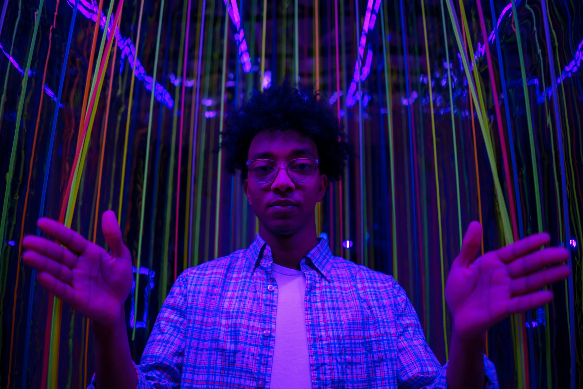 a close up of a person wearing a tie, an album cover, inspired by Bruce Munro, pexels contest winner, kinetic art, brightly lit purple room, afro futuristic, glowing - thin - wires, full body within frame