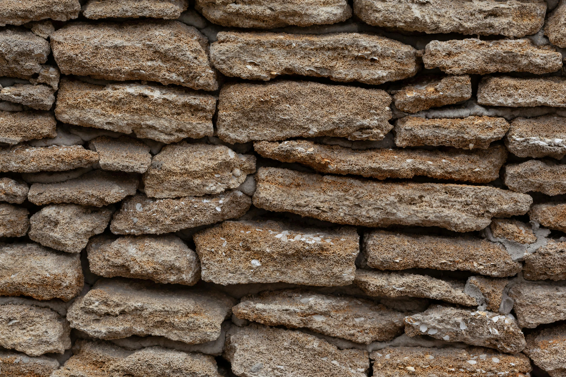 a red fire hydrant sitting in front of a stone wall, a digital rendering, unsplash, renaissance, 4 k seamless mud texture, jagged blocks of stone, light - brown wall, thumbnail