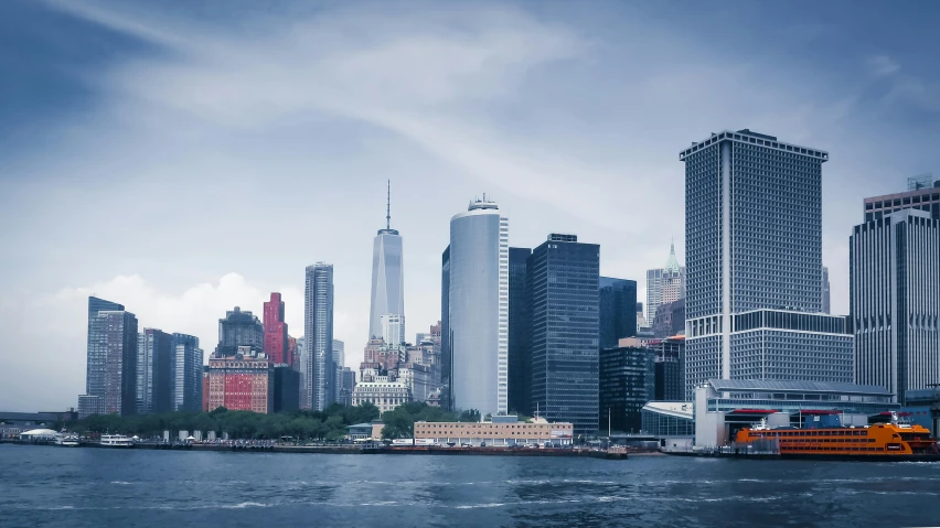 a large body of water with a city in the background, a picture, new york buildings, 7 0 mm photo, fan favorite, 4 k image