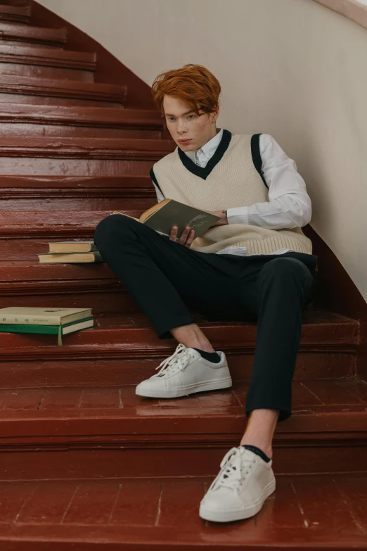 a woman sitting on a set of stairs reading a book, inspired by jeonseok lee, trending on pexels, renaissance, red haired teen boy, jk uniform, androgynous male, off - white collection