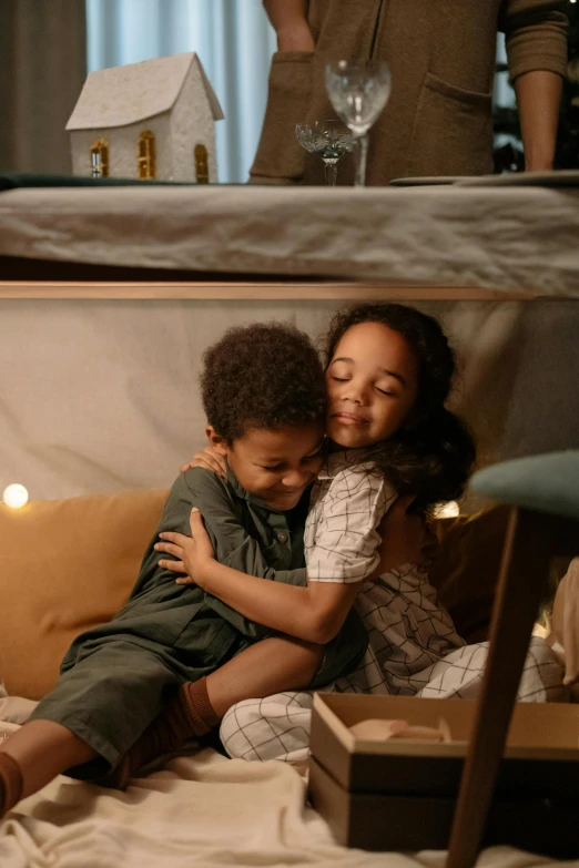 a couple of people sitting on top of a bed, a picture, with a kid, hugging each other, promotional image, softplay