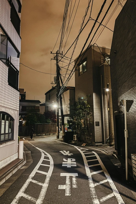 an empty street in the middle of a city at night, a picture, unsplash, ukiyo-e, spooky photo, ad image, residential area, good lighted photo