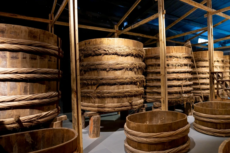 a room filled with lots of wooden baskets, inspired by Gatōken Shunshi, unsplash, 9 steel barrels in a graveyard, shibari, song dynasty, réunion des musées nationaux