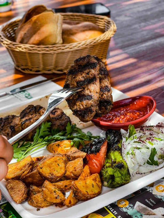 a close up of a plate of food on a table, by Orshi Drozdik, barbecue, thumbnail, baris yesilbas, profile image