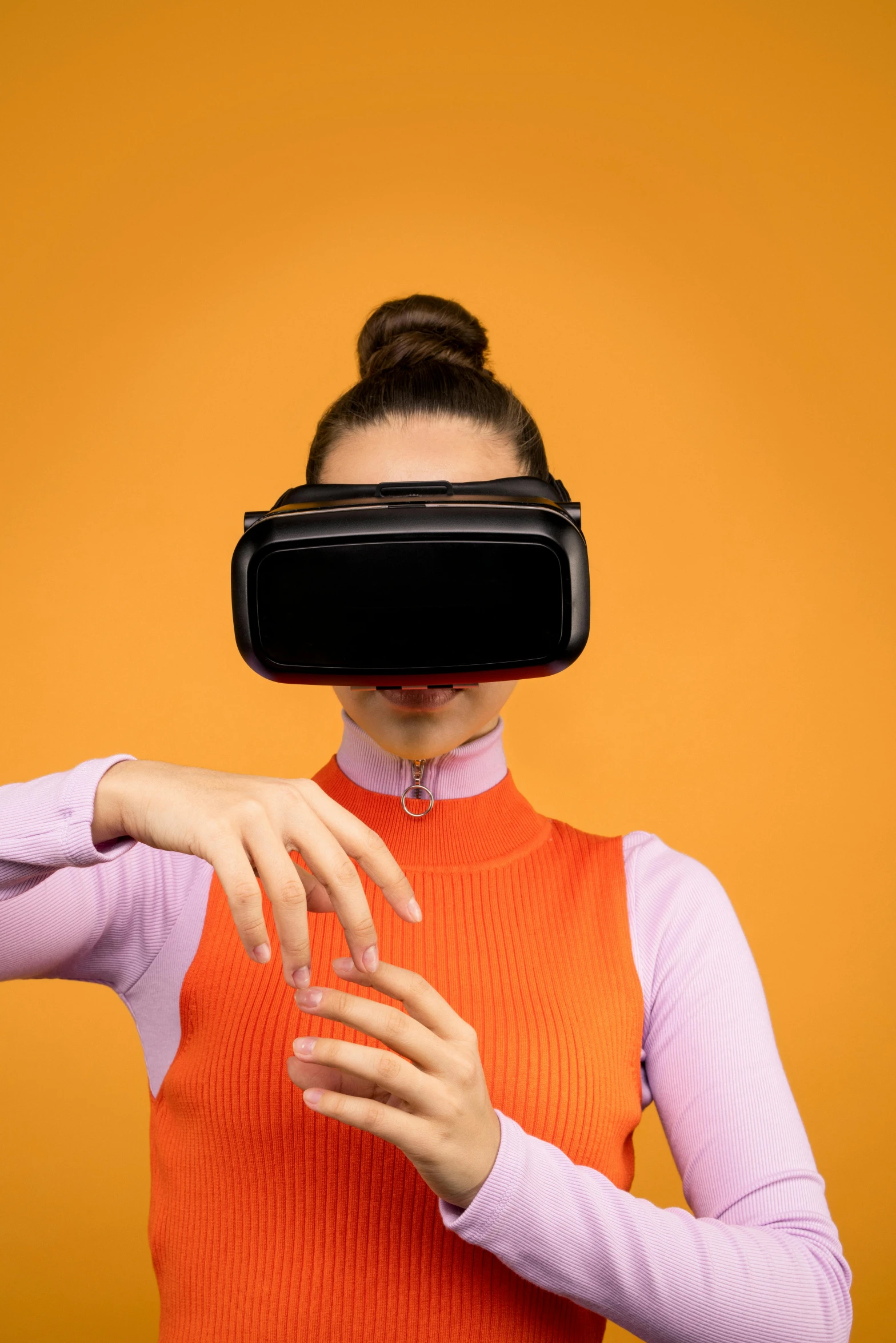 a woman holding a glass of water in front of her face, a hologram, by Paul Bird, shutterstock, hypermodernism, wearing vr goggles, in front of an orange background, square, programming