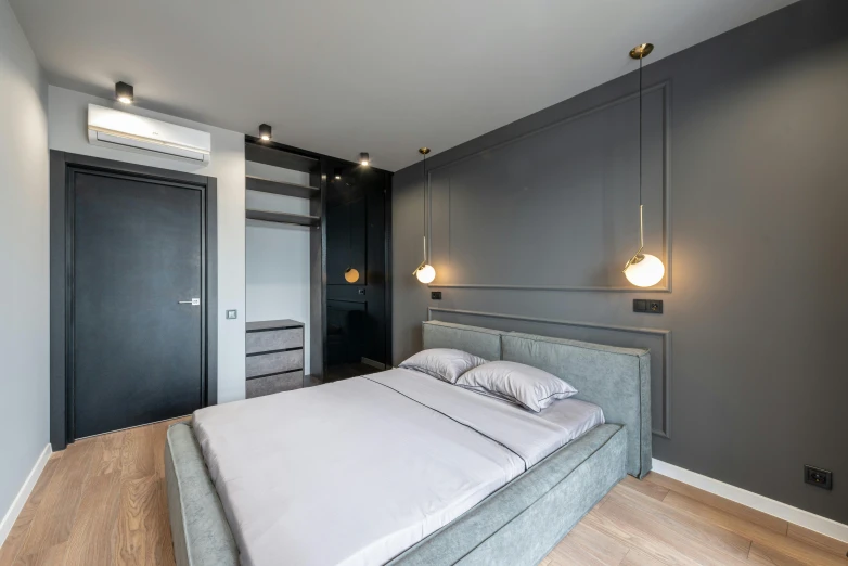 a bed sitting inside of a bedroom on top of a hard wood floor, by Adam Marczyński, pexels contest winner, light and space, grey and gold color palette, anthracite, two wooden wardrobes, neon accent lights