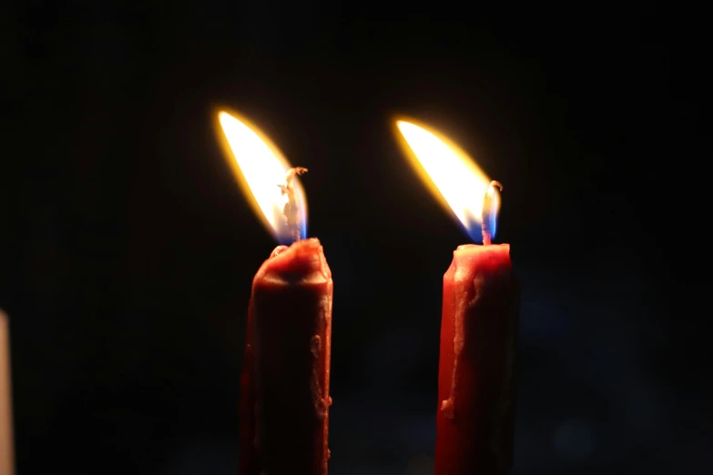 a couple of candles sitting next to each other, profile image, dark blue and red, multiple stories, unedited