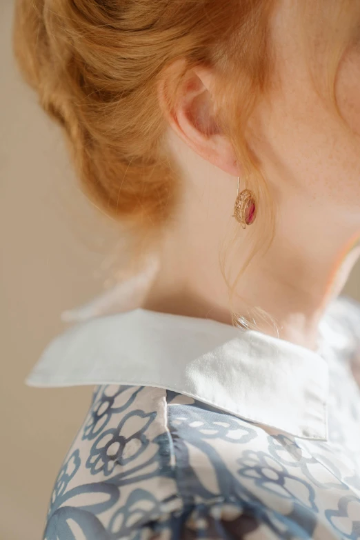 a close up of a woman with red hair, a cartoon, inspired by Mary Beale, trending on pexels, rococo, thin round earrings, lapel, delicate patterned, jewelry photography