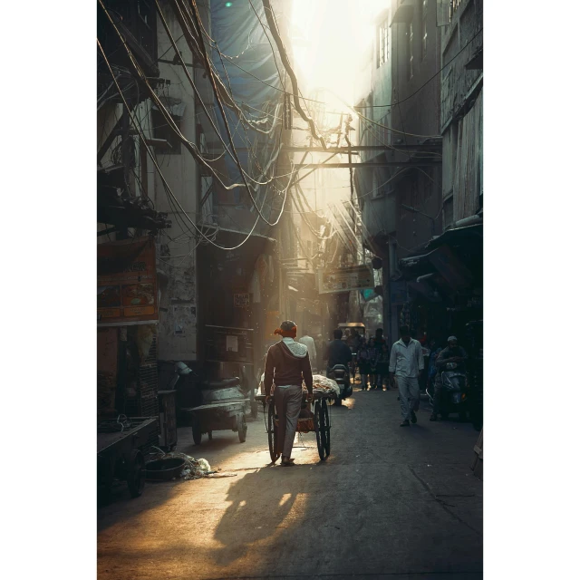 a man riding a bike down a street next to tall buildings, poster art, by Riza Abbasi, ethereal back light, alleys, street printed poster, the sun shines in