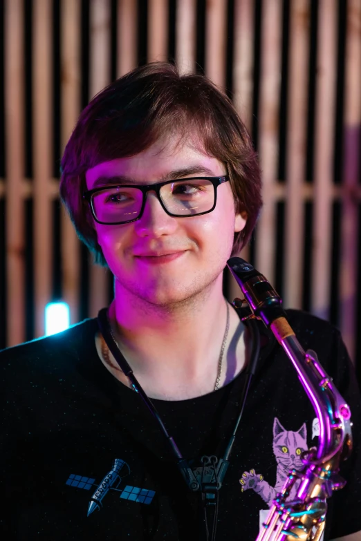 a close up of a person holding a saxophone, inspired by miles johnston, happening, slight nerdy smile, discord profile picture, studio shot, twitch streamer / gamer ludwig