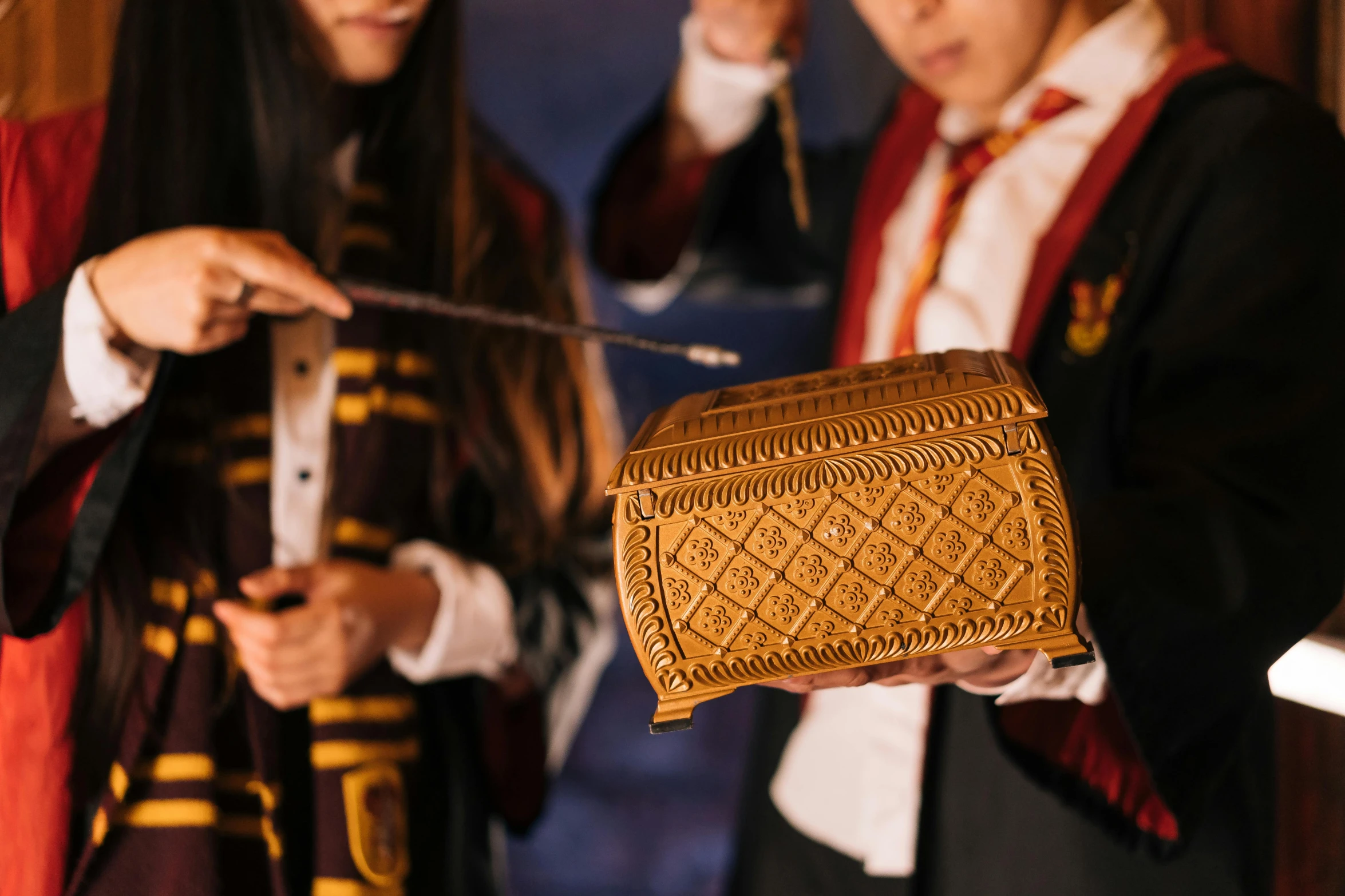 a couple of people standing next to each other, an album cover, trending on pexels, hurufiyya, looking at the treasure box, ron weasley, detail shot, costume