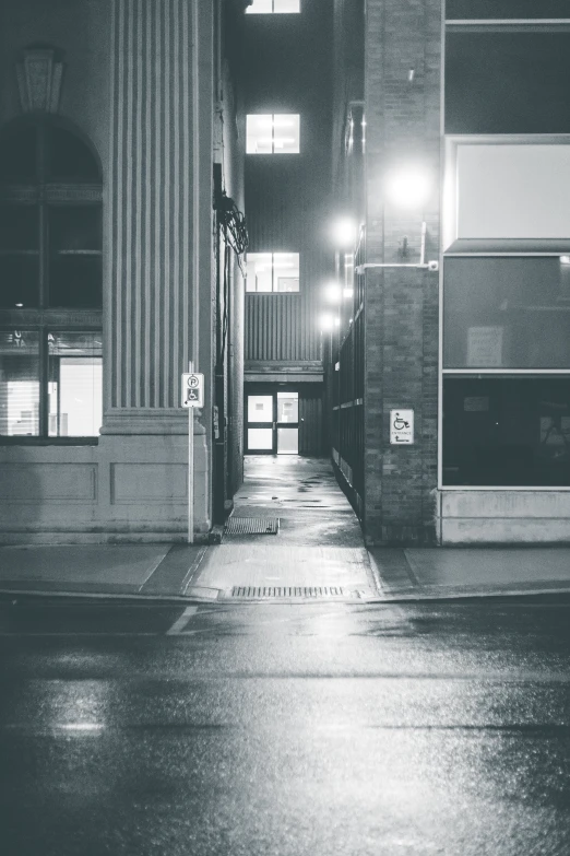 a black and white photo of a street at night, a black and white photo, unsplash contest winner, postminimalism, grey warehouse background, on a sidewalk of vancouver, early morning mood, abandoned mall at night