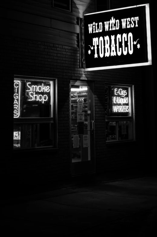 a black and white photo of a tobacco shop, tumblr, sots art, kansas town at midnight, smoke and embers, low key, neon aesthetic