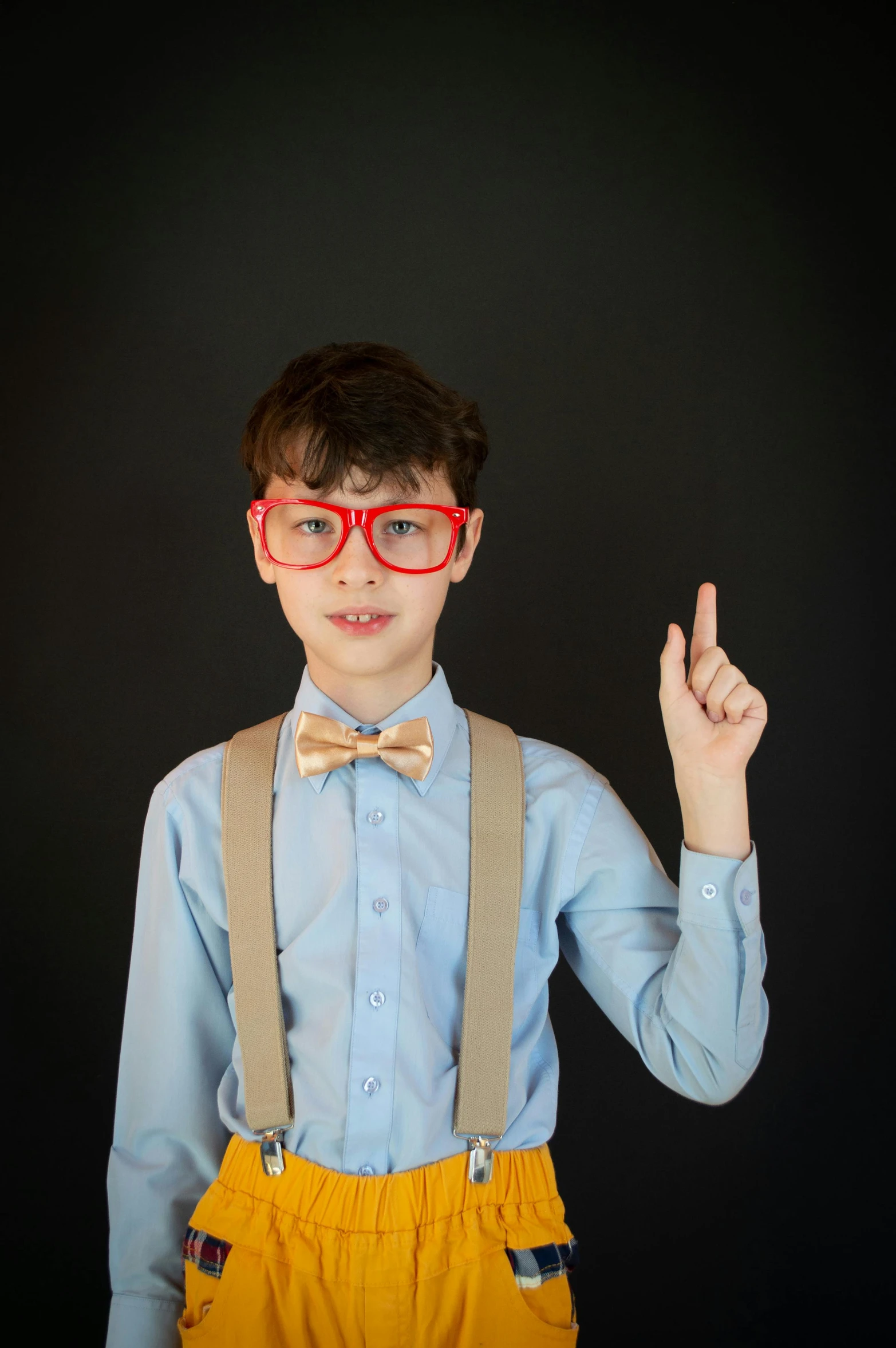 a boy with glasses and suspenders making a peace sign, pexels, incoherents, square rimmed glasses, brown red blue, academic clothing, professional photo-n 3