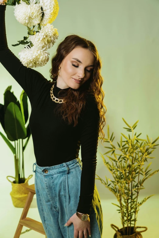 a beautiful young woman holding a bunch of flowers, a portrait, trending on pexels, renaissance, black turtleneck, woman made of plants, wearing a dark shirt and jeans, joey king