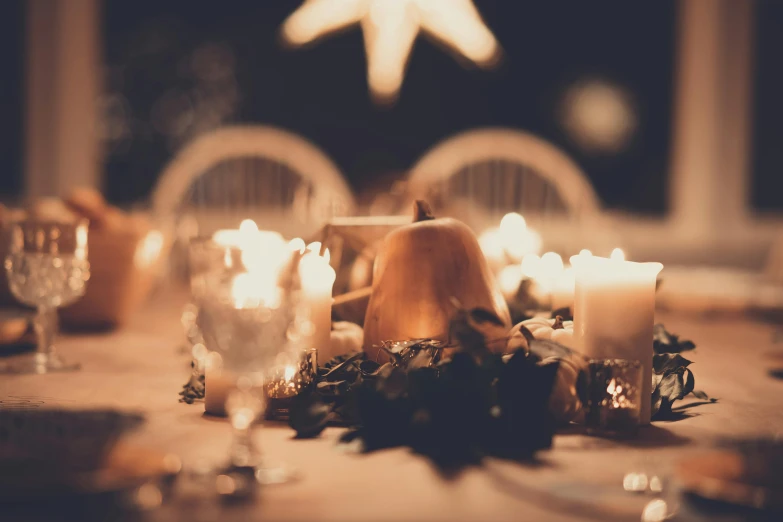 a table that has a bunch of candles on it, unsplash, christmas night, background image, vintage glow, gentlemens dinner