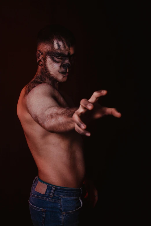 a shirtless man standing in front of a black background, an album cover, trending on pexels, transgressive art, lucha libre, humanoid animal, halloween, aboriginal