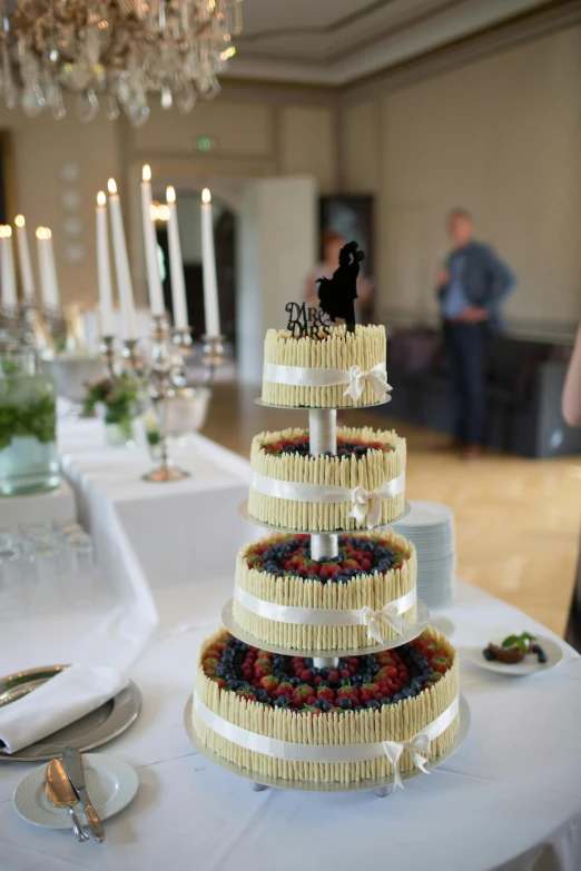 a wedding cake sitting on top of a table, by Nina Hamnett, happening, fruit, hammershøi, stanchions, edible