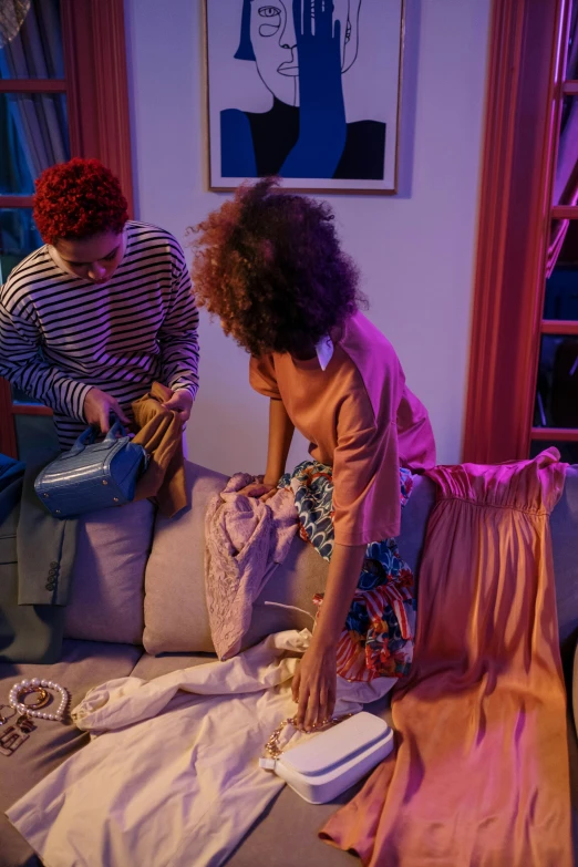 a couple of people that are sitting on a couch, a picture, purple clothes, inside a cluttered bedroom, ashteroth, pink and blue lighting