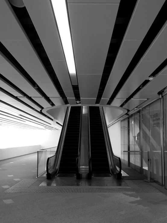 a black and white photo of an escalator, light and space, in chippendale sydney, bus station, underground!!!!, taken in 2 0 2 0